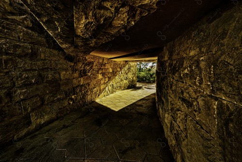 A shot of a narrow rocky corridor in one of the gardens in the city of Riyadh