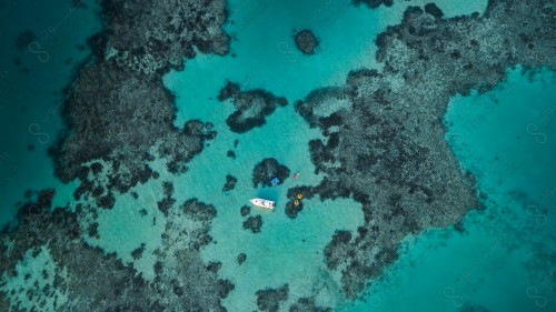 An overhead view of a group of boats in the Jeddah Sea, Saudi Arabia. Fishing boats above the surface of the water. sea ​​water .