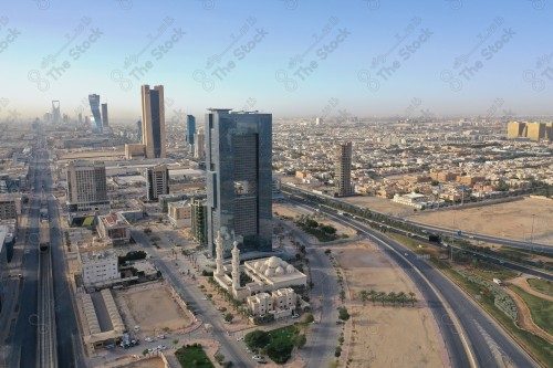 An aerial photo of the capital, Riyadh, and it shows the sky is almost clear during the day, the towers in the city of Riyadh