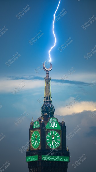 Lightning strikes the top of the Clock Tower in Mecca, with the crescent moon at the peak.