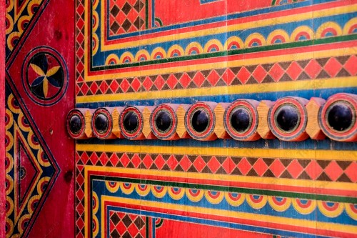 Wooden Antique door built into mud wall - Old traditional wooden door in Saudi Arabia