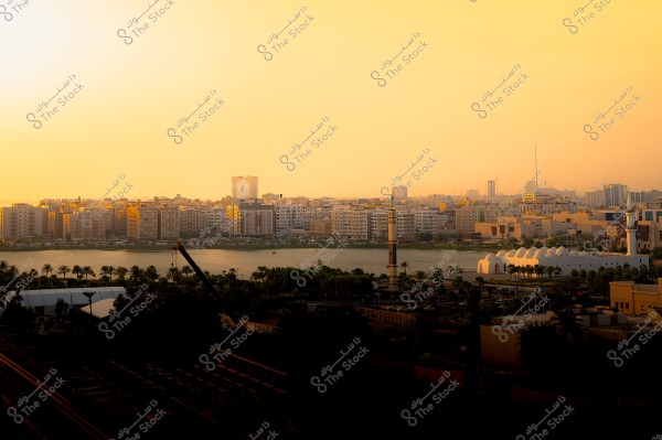 A view of Jeddah city skyline at sunset, featuring the Red Sea and surrounding buildings prominently.