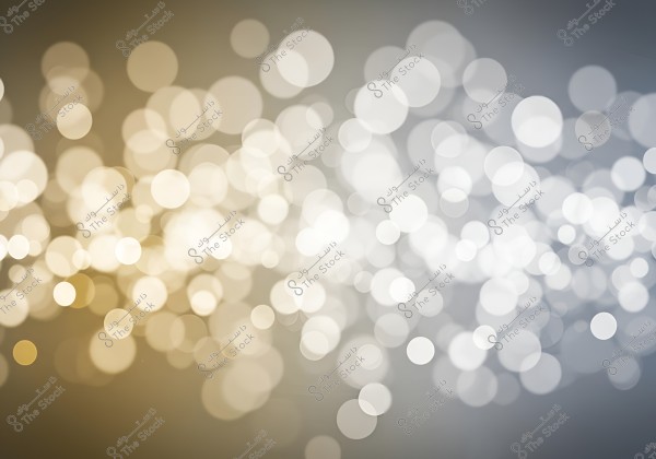 An image featuring blurred light effects with various colors ranging from gold to white on a gray background. The image highlights circular bokeh spots with different levels of blur, giving an impression of movement and scattered lights.