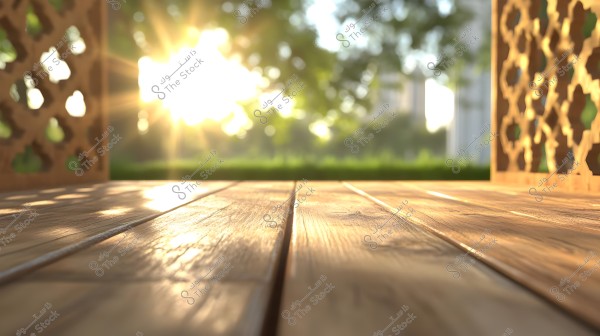 The image shows a sunlit wooden floor in the foreground, with an intricately patterned wall on the right featuring Arabic designs. In the background, there are green trees and a partly cloudy sky, with sunlight streaming in from the upper left corner.