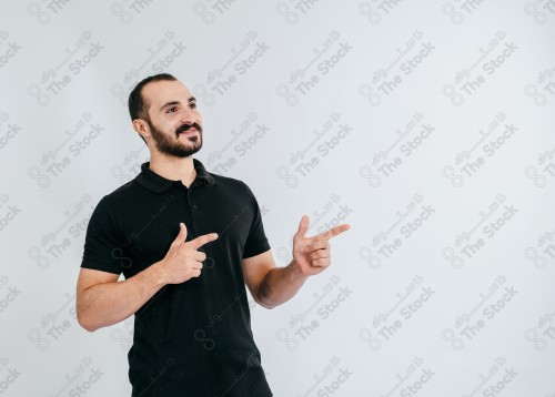 Portrait of a Saudi man on a white background making hand gestures while smiling, souvenir photos, documenting a happy moment