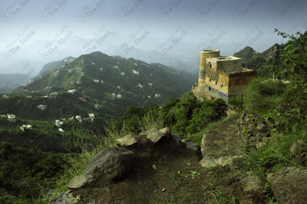 A snapshot of a series of mountains and green areas in Fifa, southern Saudi Arabia, houses on mountain heights, nature in Saudi Arabia