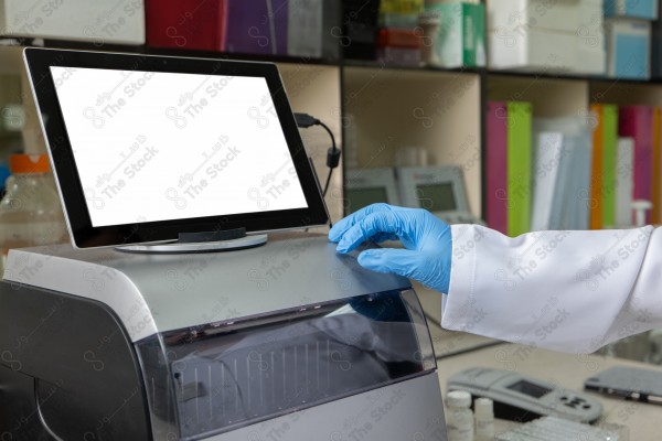 A shot of a female doctor using the device to fill out data.