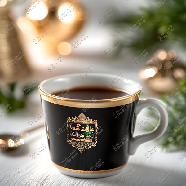 A black ceramic coffee cup with a golden rim and ornate Arabic inscriptions, filled with hot black coffee. The background features some decorative and green elements, conveying a sense of warmth and coziness.\r\n\r\n###