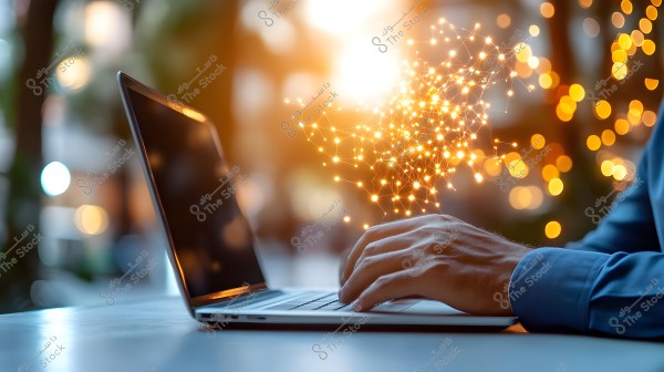 The image shows a hand typing on a laptop in a blurred environment characterized by warm lights. Emanating from the screen is a pattern of interconnected glowing dots representing a network or digital data, conveying a sense of advanced technology.