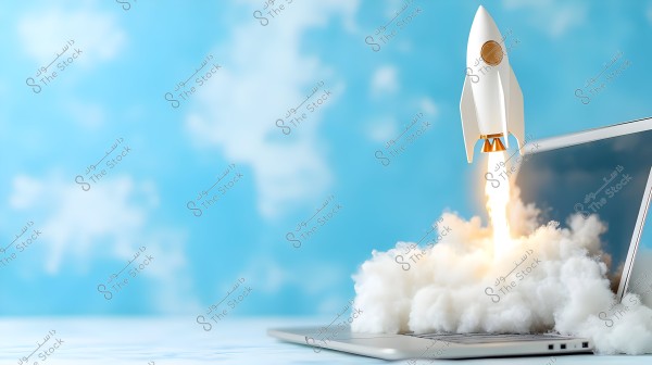 Image shows an open laptop on a table with a small white rocket launching from the keyboard, emitting smoke. The background is blue with white clouds, giving an impression of space or an open sky.