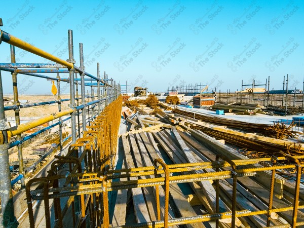 A construction site with a large building in the background. multi-storey building. A construction site with scaffolding and a large building in the background.