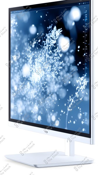 A large computer monitor with a sleek white frame. The screen displays abstract images of sparkling lights and floral patterns in blue and white tones, creating a sense of calm and tranquility.