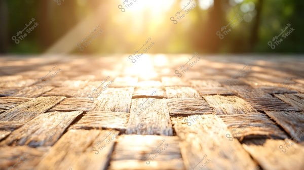 Image showing a surface made of interwoven wooden pieces in a woven pattern, lit by sunlight. The background is blurred with bright sunlight, creating a warm feeling and enhancing the natural texture of the wood.