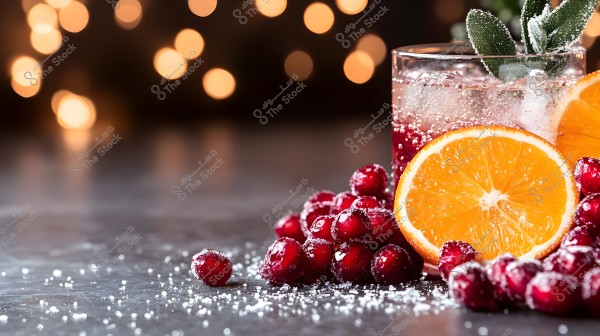 An image showing a drink in a transparent glass garnished with orange slices and red berries. The glass is filled with a fizzy beverage with ice cubes and green leaves. The background light appears as glowing circles, creating a warm and festive atmosphere. The berries are dusted with sugar crystals and scattered over a gray surface.