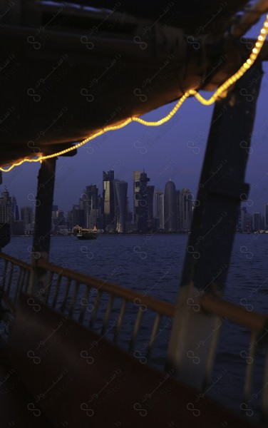 A shot from inside the ship of a group of buildings for the city of Doha, the Qatari capital, skyscrapers, buildings and landmarks.