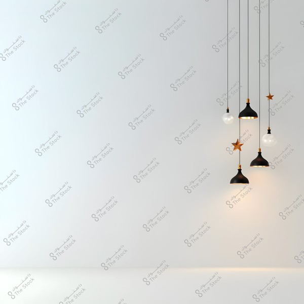 A set of modern pendant lamps hanging from the ceiling against a simple white background. The lamps are black with orange accents, and some are decorated with star shapes.