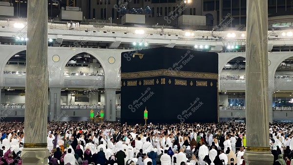 A scene of large crowds of pilgrims around the Kaaba in the Grand Mosque, Mecca.