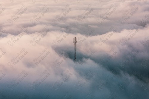 A snapshot showing the Black Mountain in the Jazan region in the south of the Kingdom of Saudi Arabia, an electrifying pillar among the clouds, historical and tourist landmarks, mountainous heights, Jazan mountains, mountainous nature in Jazan