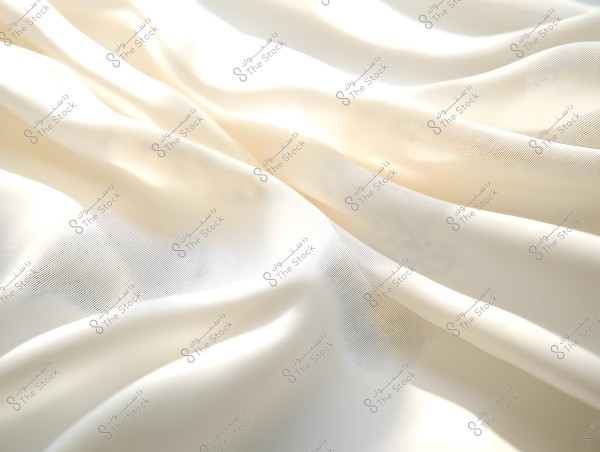 An image of soft, flowing beige fabric. The fabric features natural creases that form interwoven lines, creating a gentle and attractive visual effect.
