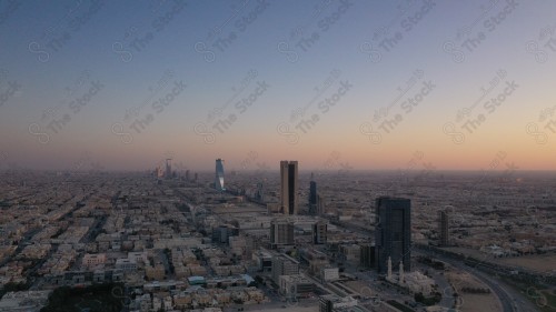 An aerial photo of the capital, Riyadh, and it shows the sky is almost clear during the day, the towers in the city of Riyadh