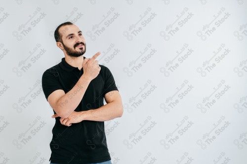 Portrait of a Saudi man on a white background making hand gestures while smiling, souvenir photos, documenting a happy moment