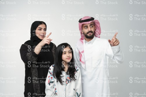 Saudi family making gestures