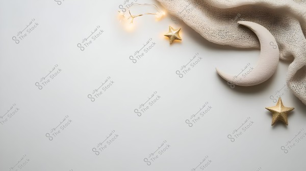 An image featuring a white background with a wooden crescent moon on the right side. Next to the crescent are two small golden stars and a soft white fabric. There is also a string of small lights glowing softly in the upper left corner.