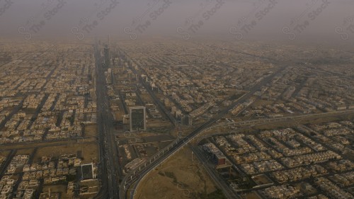 An aerial view of the capital, Riyadh, showing cloudy sky during the day, the towers in the city of Riyadh