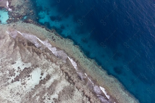 An aerial shot of the coral reefs in Shuaiba, on one of the beaches in Jeddah. Clear sea water.