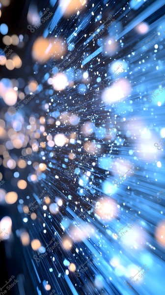 An abstract image depicting an explosion of light dots and streaks in soft blue hues. The lights are dispersed in various directions, creating a dynamic effect resembling light speeds.