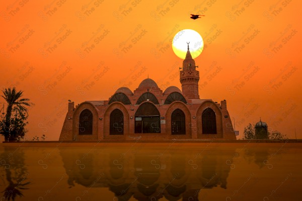 A snapshot of the sunset and the change of the sky in orange for the Muhammad Hassan Al-Farsi Mosque in the city of Jeddah, mosques, worship.