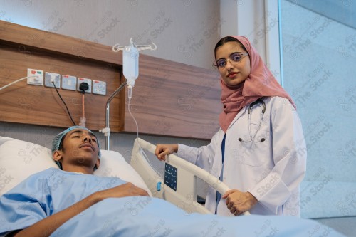 A Saudi female doctor wears a medical uniform and is examining and applying a nutrient solution, medicine and health care