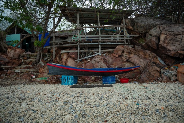 Shot of a boat at James Bond Beach in the region of Thailand and the sky appears cloudy during the day, nature in Thailand, island, mountains