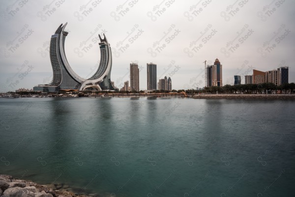 A snapshot of the towers and skyscrapers overlooking the Arabian Gulf in the Qatar region, Doha tourist attractions, tourism in Qatar, Qatar Towers, a tourist waterfront in the State of Qatar.