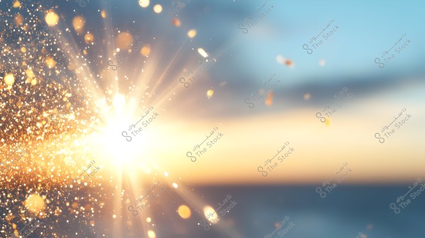 An image showing a burst of light with golden sparkles against a background that transitions from blue to orange, suggesting a celebratory atmosphere or a sunset.