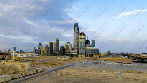 A snapshot showing the buildings and landmarks of the financial center of the city of Riyadh, and the sky appears cloudy during the day, skyscrapers.