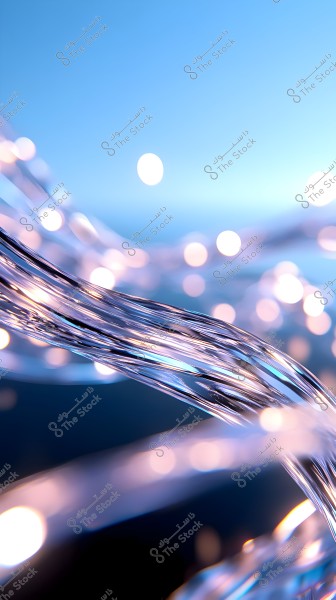 An abstract image featuring transparent strands flowing in curvature against a blue background. The strands are interspersed with bright lights resembling sparkles, creating a mesmerizing and shimmering effect in the image.