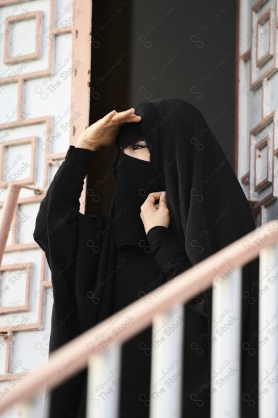 A shot of a Saudi woman wearing the traditional Saudi dress representing the folklore, the foundation day, and the Saudi culture