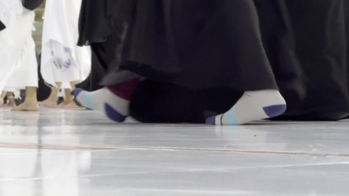 A video showing Legs from People of Walking inside the Great Mosque of Mecca.